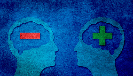 Positive and negative thinking, contrasts. Two heads silhouettes with plus and minus signs on dark blue banner background.