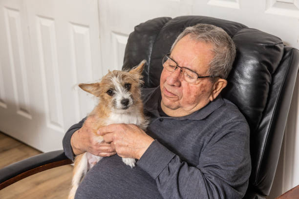 istock Senior Man Relaxing with Puppy 1958018758