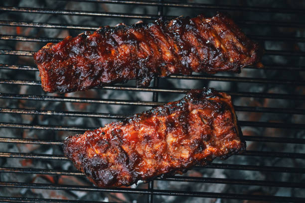 istock BBQ Pork Spareribs on Barbecue Grill 1958020417