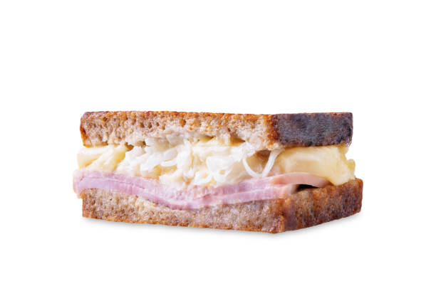 istock Reuben sandwich with ham, sauerkraut and cheese on a white isolated background 1958049367