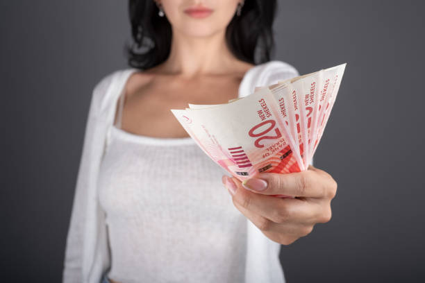 istock Women hold euros in their hands 1958060422