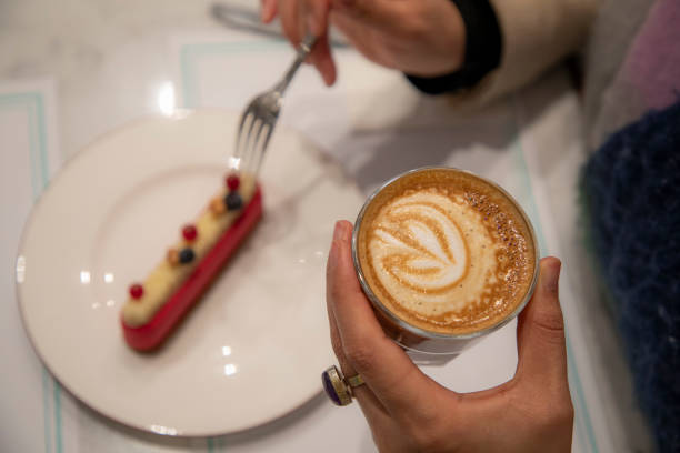 Paris, France – May 08, 2016: A charming cafe on a bustling boulevard in Paris, France