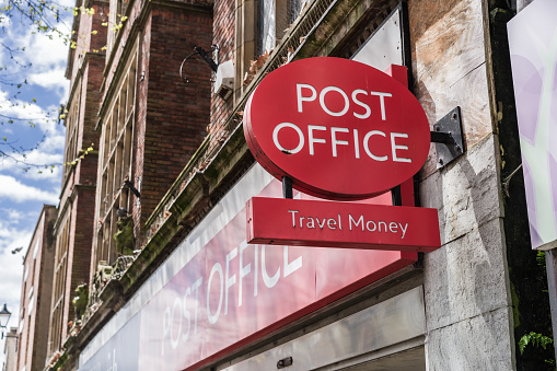 Shrewsbury, Shropshire, England, May 1st 2023. Post Office Travel Money signage on building, travel and finance editorial illustration.