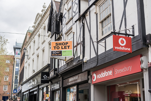 Shrewsbury, Shropshire, England, May 1st 2023. Vodafone mobile phone store on traditional high street, retail, travel and tourism editorial illustration.