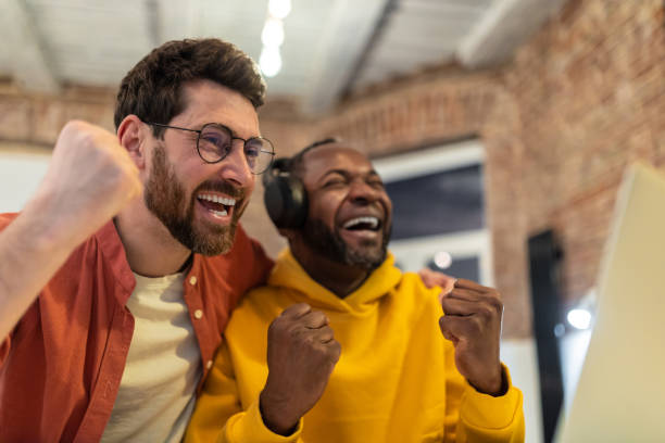 istock Two colleagues working together and looking excited 1958114158
