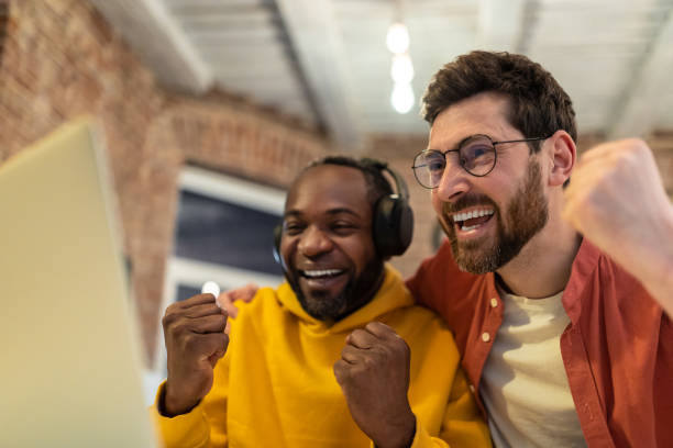 istock Two colleagues working together and looking excited 1958114161