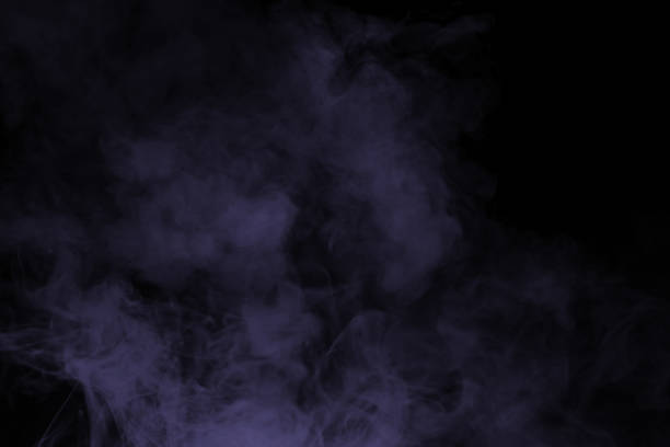 Orange and red steam on a black background. Copy space.