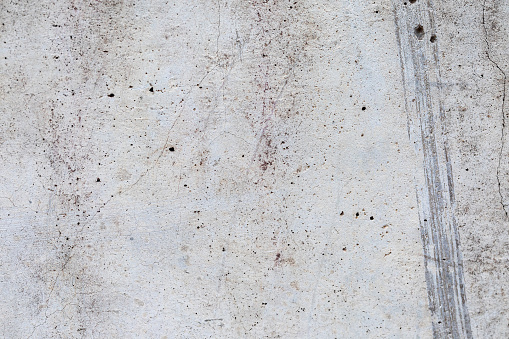 concrete wall background with scratches and cracks for cover design, presentations, illustrations on the topics of urbanism, architectural design, and urban environmental research