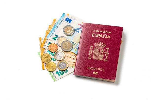 spanish passport and european union currency isolated on white background. copy space - european union coin european union currency coin isolated objects imagens e fotografias de stock