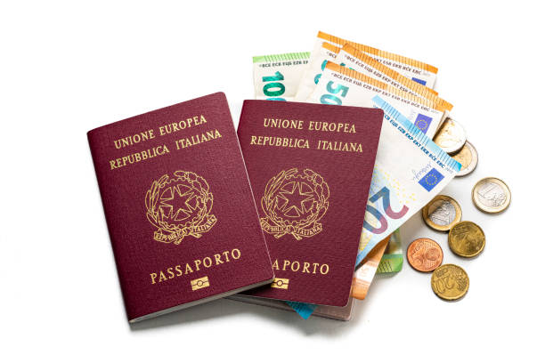 italian passport and european union currency isolated on white background. copy space - european union coin european union currency coin isolated objects imagens e fotografias de stock