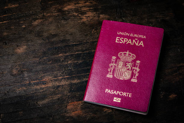istock Spanish passport on dark wood background. Copy space 1958178365