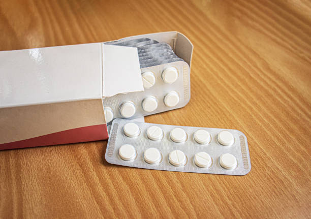 istock cardboard pack with tablets in a blister on the table, concept of long-term treatment 1958179901