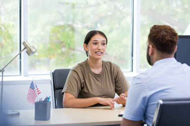 istock Female veteran explains her plans to her banker 1958185711