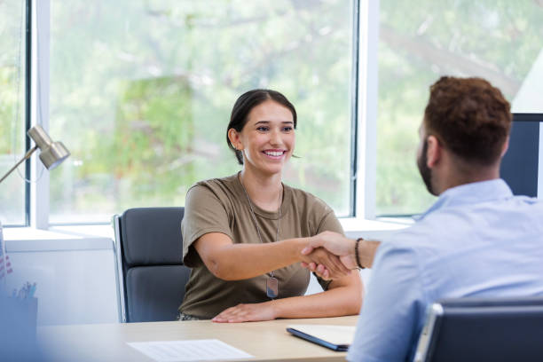 istock Female veteran shakes hands with her supervisor 1958186306