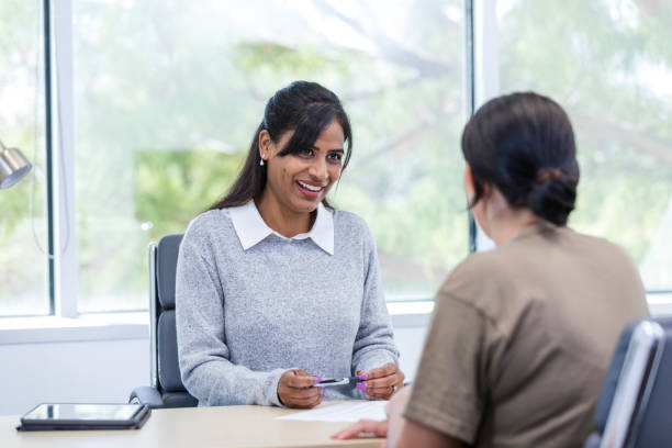 istock Mid adult female recruiter meets with a new client 1958186777