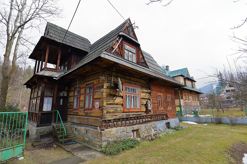 Zakopane, Poland - March 08, 2016: Old residential house made of wood built ok.1920 year is registered in the municipal register of architectural monuments.