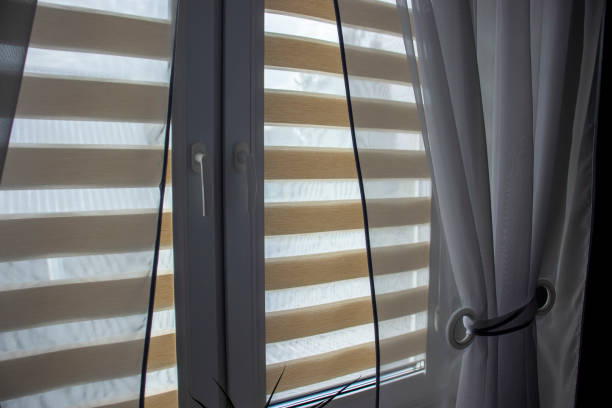 istock Cozy room interior with day-night blinds on the window. 1958198073