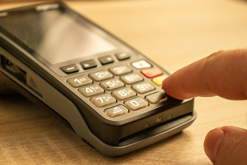 Closeup view of a payment terminal with banking concept.