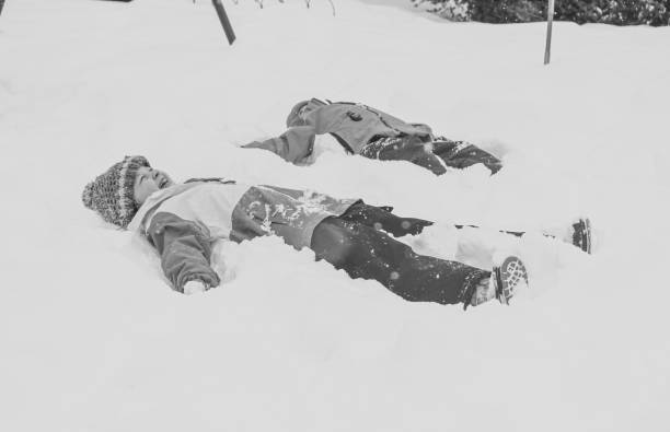 Beautiful woman tourists enjoying play with snow at village