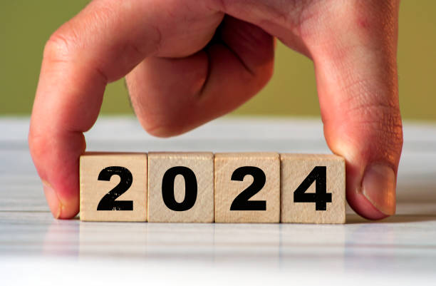 istock Welcoming 2024: numerical wooden blocks depicting the New Year with festive elements. 1958279574