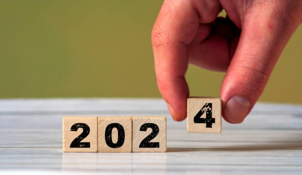 istock New Year 2024 text on wooden cube blocks on Christmas lights backdrop 1958283207
