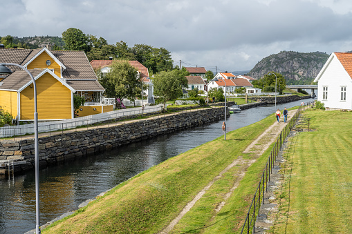 Lindesnes, Norway - August 26 2023: The Spangereid canal is dug through the small town centre.