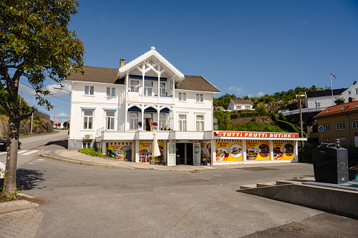 Grimstad, Norway - August 27 2023: Wooden house with a candy store on the ground floor.