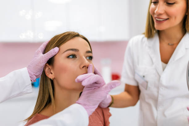 istock A doctor examines the patient before the aesthetic procedures. 1958297376