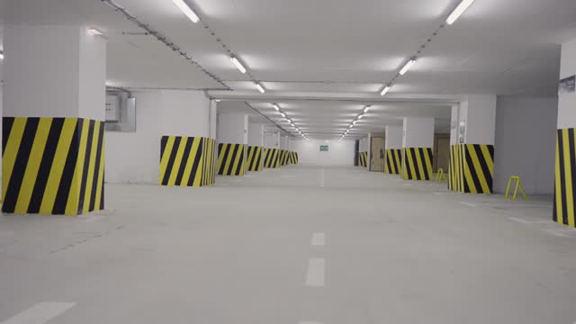 Empty underground parking lot in modern building
