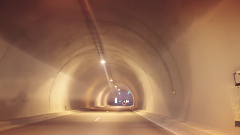 Driving slowly through a illuminated tunnel