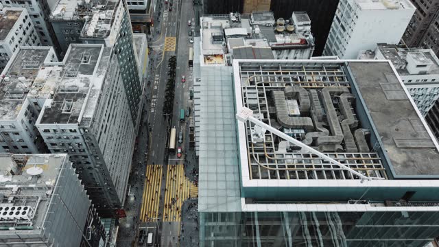 Timelapse of pedestrian tourist people crossing the street with vehicle traffic in Hong Kong, aerial view