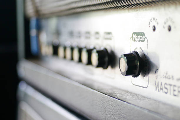 Close up electric guitar amplifier. Master regulator knob, volume level.