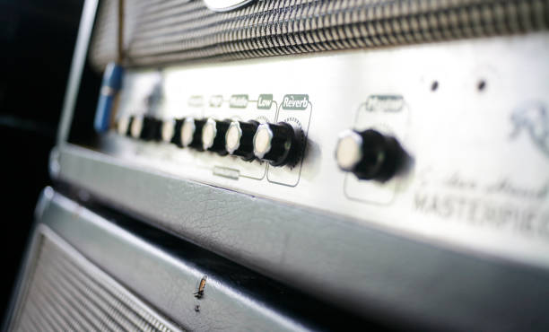 istock Close up electric guitar amplifier. Master regulator knob, volume level. 1958354782
