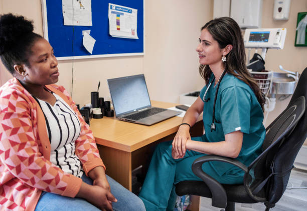 istock Smiling doctor talking with a patient during an appointment 1958406353