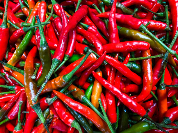 istock Red hot chilli peppers texture background. Close up view with copy space for design 1958407981