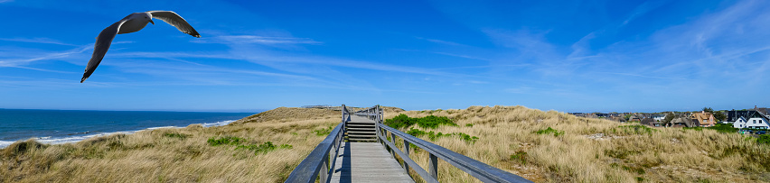 Usedom Island, Mecklenburg Western Pomerania, Germany - May 9, 2021: Access to the beach on the Baltic Sea in Heringsdorf on Usedom.