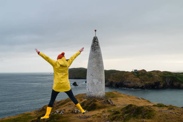 Woman jumps on Lighthouse Baltimore Ireland