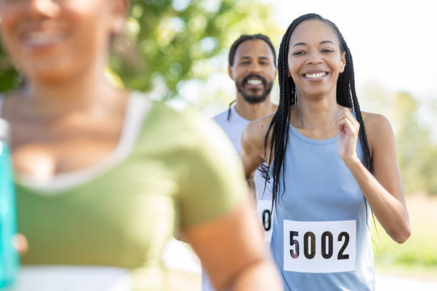 istock A varied group of individuals runs a 5k marathon, supporting a charitable organization. 1958459193