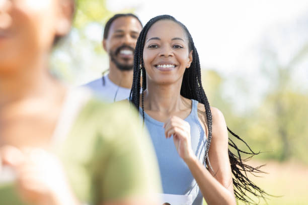 istock A diverse array of adults engages in a 5k race, striving to make a positive impact through charity. 1958459202
