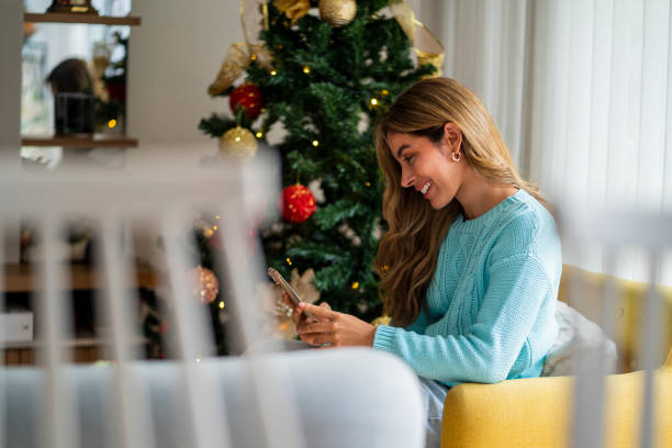 istock Woman is using her phone at home 1958490270