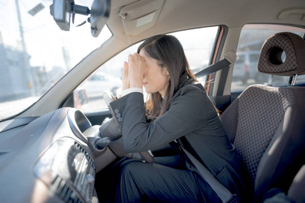 istock driving woman in a car 1958531734