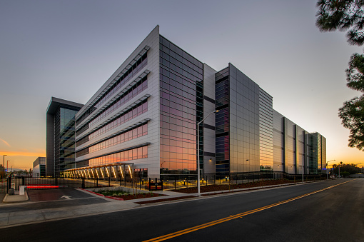 Large office building at sunset.