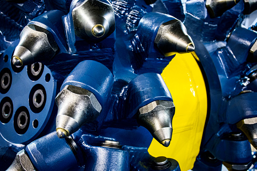 Close-up of drum cutter - attachment for excavator that typically used for rock excavation, demolition, tunnel profiling... cutting rock or concrete.