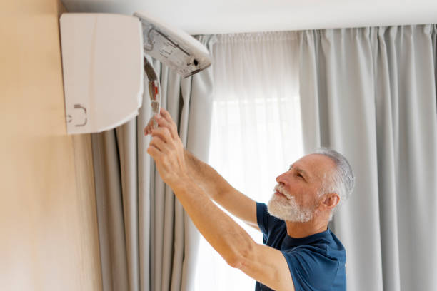 istock Repairman cleaning air conditioner, remove dirty filter at home 1958606025