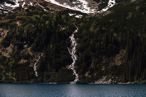 Waterfall in Zakopane, Tatra mountains. Water fall in Morskie Oko lake. Beautiful landscape, traveling and tourism photography of Polish nature.