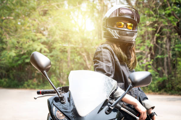 istock Confidence Asian woman wearing a motorcycle helmet before riding. 1958753387