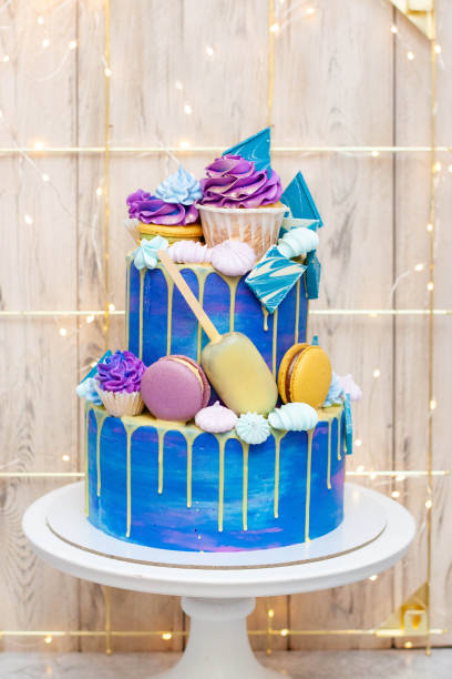 istock Layered blue cake on cake stand on a festive background. A picture for a menu or a catalog of confectionery products. 1958761043