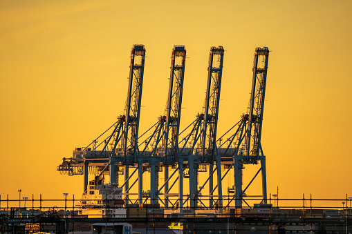 Portsmouth Virginia - January 24 2024: Shipping Port Terminal Cranes in Portsmouth Virginia at Sunset