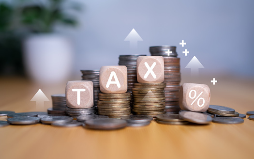 Tax wooden letter, Tax concept.Income tax return, Tax payment and tax deduction planning involve strategies to minimize tax liability, deferring income, tax professional.
