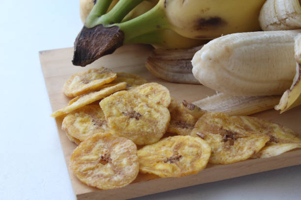 istock Portion of delicious banana chips. 1958820545